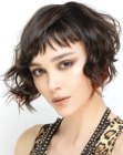 Short angled bob with a longer front and curls