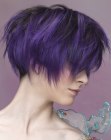 Short hairstyle with feathery texture and a purple hue