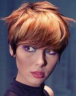 Perky short hairstyle with alternating layers of blonde and red