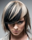 Chin length bob with layers of blonde, black and brown hair