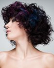 Curly hair with a combination of black, purple and blue hues