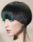 Dark bowl cut hair with green color accents