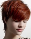 Soft pixie cut with a long neck section for red hair