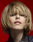 Chin length bob with curved in sides and long bangs