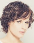 Short layered hair with bangs and wet look styling