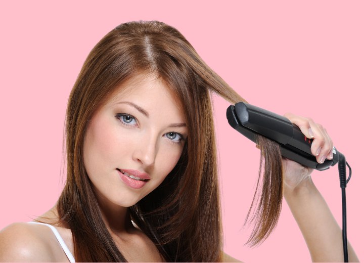 Woman who is using a flat iron