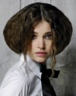 Partial updo with backcombing and loose tendrils