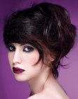 Updo with loosely gathered hair and teased bangs
