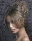 Airy updo with the hair high up in the back