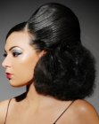 Updo with curls and smooth slick surfaces