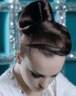 Sleek updo with a slung ponytail