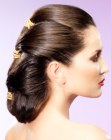 Sleek ponytail hairdo with triple binding