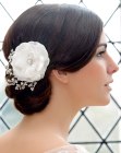 Chignon with a large flower hair accessory