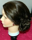 Updo with a double twist on a training head
