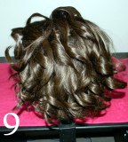 Top curls curled towards the back of the head