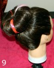 Hairstyle created with a sock bun roll