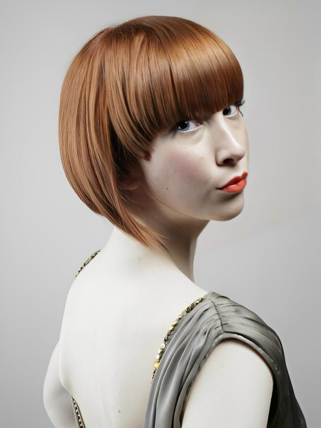 Sleek bob and a vribrant red hair colour to accentuate a slender neck