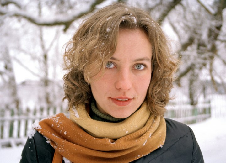 Young woman with snow on her hair