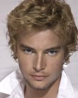 man with blonde curls