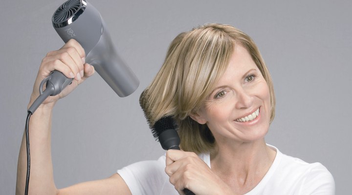 Roll the ends of the hair over a brush