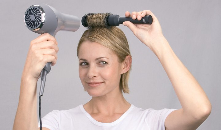 Dry hair over a round brush