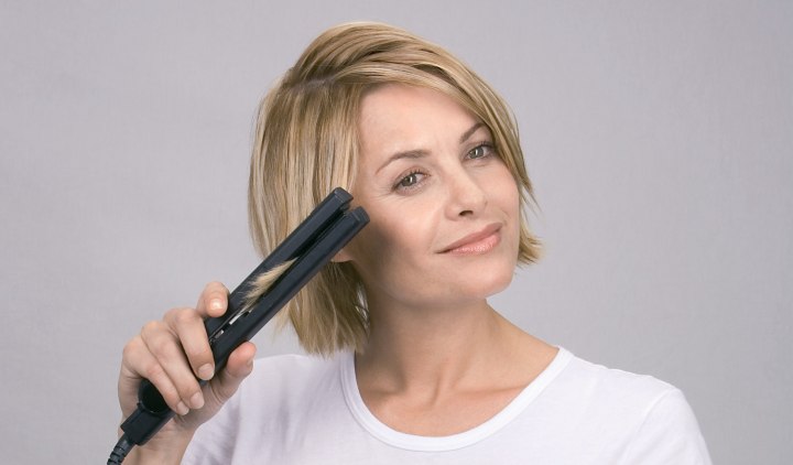 Treat hair with a flat iron