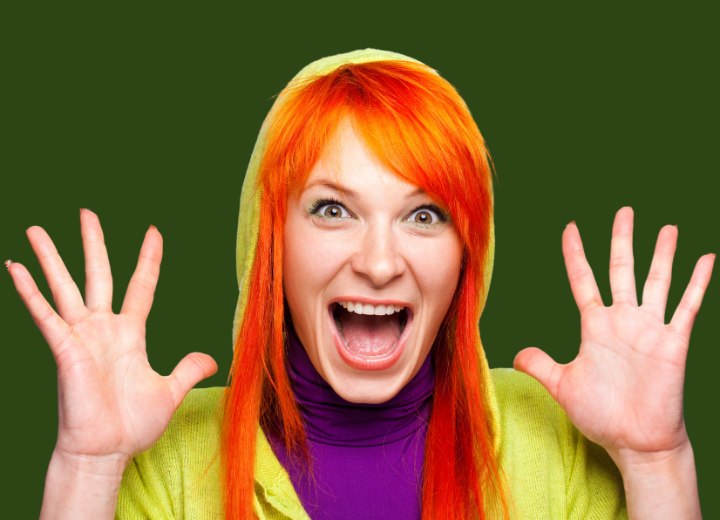Girl with orange hair wearing a smooth purple turtleneck