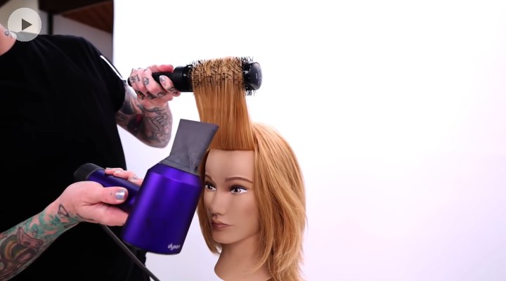 Styling bangs with a round brush and blow-dryer