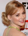 Alexandra Breckenridge sporting a loose updo with a bun