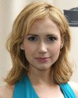Ashley Jones sporting a medium long haircut with messy styling