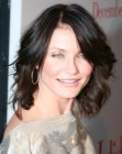 Cameron Diaz with dark shoulder length curly hair