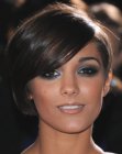 Frankie Sandford's short asymmetrical hair with one side cut around the ear