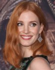 Jessica Chastain wearing her red hair in  a shoulder length style