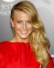 Julianne Hough with her long curled hair swept to one side
