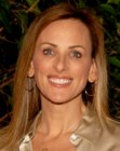 Marlee Matlin's long hairstyle with a high side part