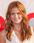 Redhead Mini Anden sporting long hair with layers and a middle part