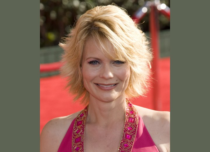 Jann Carl with outward-flipping hair
