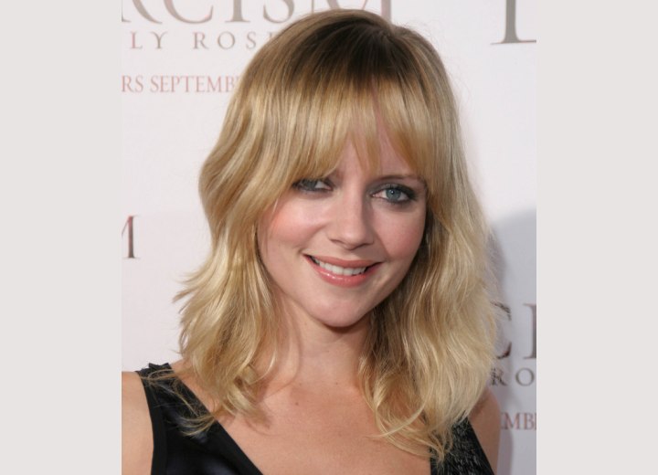 Marley Shelton wearing a long shag hairstyle