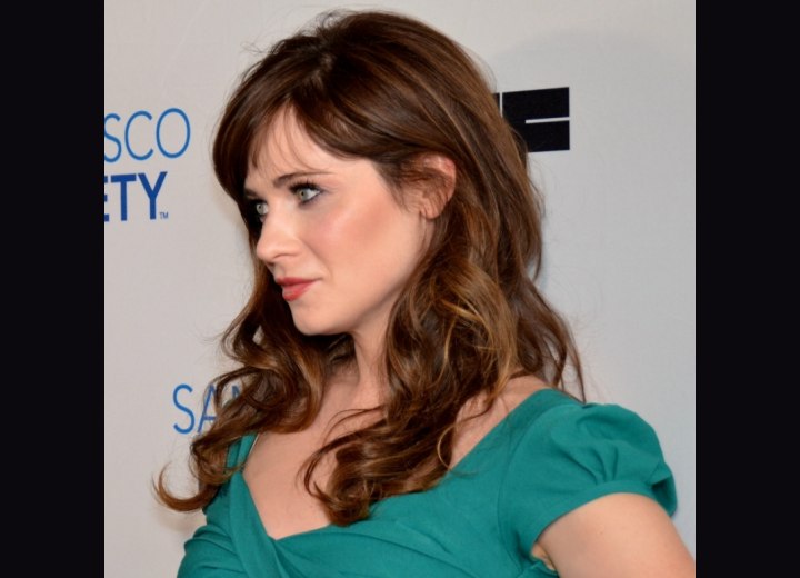Zooey Deschanel with long, curled hair