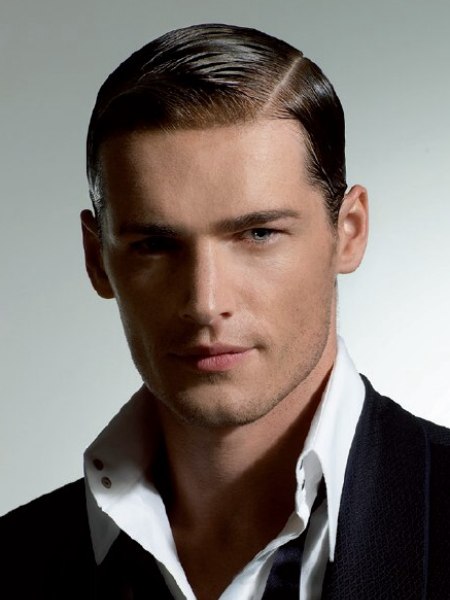 Short men's hair sleeked with pomade