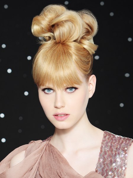 High-slung updo with a large knot on the crown