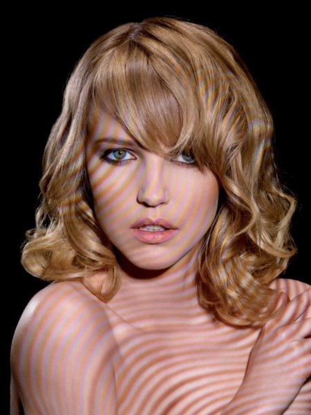 Youthful shoulder-length hair with waves and curls