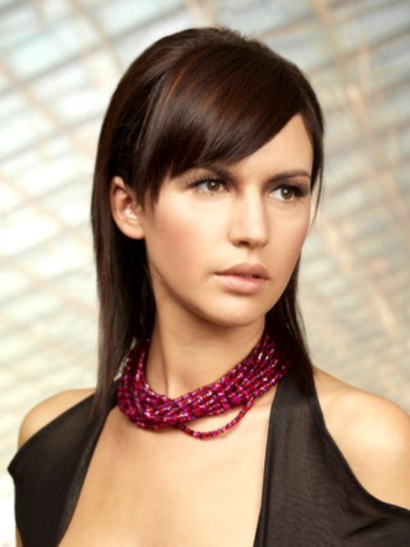 Shoulder-length hair styled with a bump at the back
