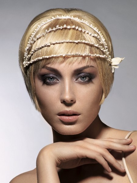 Steeply tapered blonde pixie cut