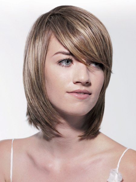 Medium-length haircut with long bangs across the face