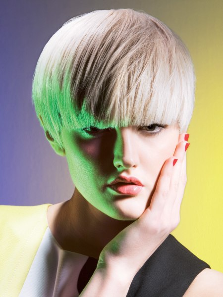 Blonde bowl cut with an ear-to-ear cutting line
