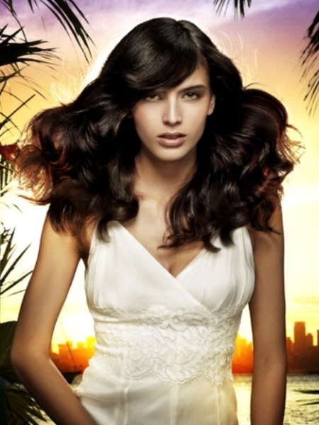 Dark hairstyle with long, rich waves