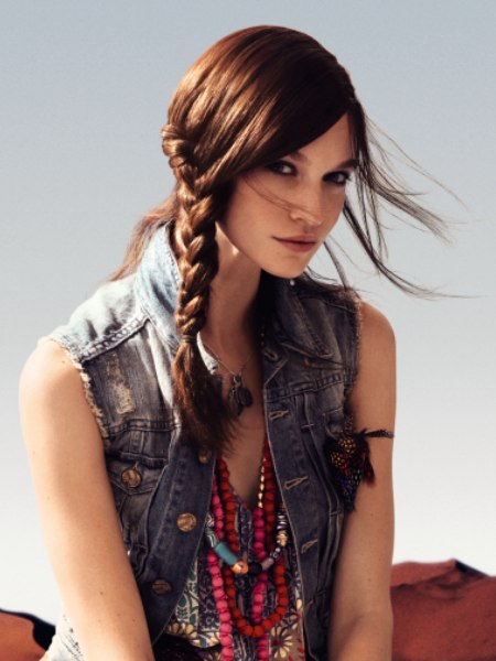 Long brown hair, braided for protection