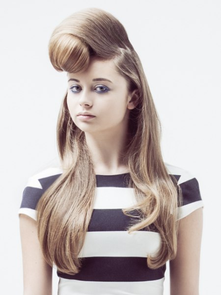 Updo with a rolled quiff that adorns the forehead and crown