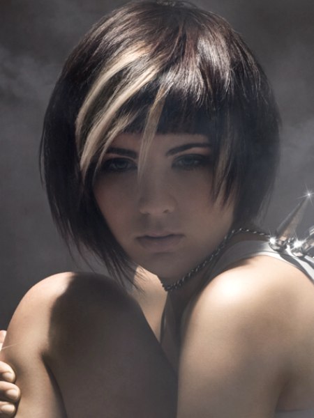 Layered chin-length brunette haircut with blonde streaks